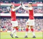  ?? OLIVER GREENWOOD/AFP ?? Arsenal striker Pierre-Emerick Aubameyang (right) celebrates scoring a goal with teammate Alexandre Lacazette during their Premier League match against Stoke City at the Emirates Stadium on Sunday.