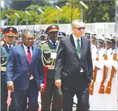  ??  ?? Turkey’s President Recep Tayyip Erdogan (right) and Mozambique President Filipe Nyusi inspect a military guard on honour in Maputo, Mozambique yesterday. — AP