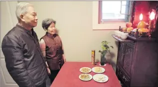  ?? NICK PROCAYLO / PNG ?? Kirk Sen- Yu Hsu and Grace Hui- Chang Chen prepare for the new year at an altar in their Surrey home.