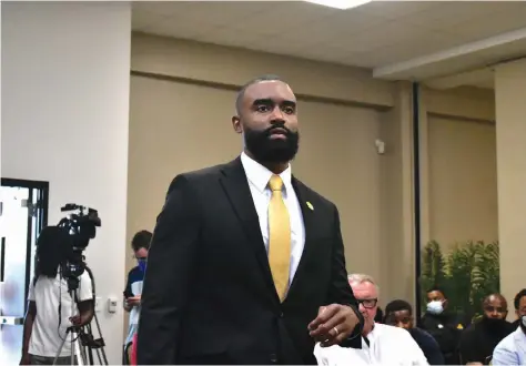  ?? (Pine Bluff Commercial/I.C. Murrell) ?? Solomon Bozeman walks into the STEM conference center to be introduced as UAPB men’s basketball coach Tuesday.