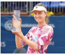  ??  ?? Mona Barthel of Germany poses with a trophy after winning the Prague Open Tennis Tournament final match against Kristyna Pliskova of Czechia in Prague Saturday. (AP)