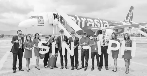  ??  ?? (From fifth left) Zuraida, Tan, Yong, Ahmad Faizal, Riad Asmat, and AirAsia’s Captain Affendy Bin Syed Omar at the Singapore-Ipoh Officiatin­g Ceremony yesterday at Sultan Azlan Shah Aiport in Ipoh.