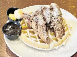  ?? ROB BOLSON ?? Goodwood Brewing offers three large and delectable pieces of some of the best moist, crispy fried chicken in Lexington with a sweet chipotle honey syrup over a fluffy waffle.