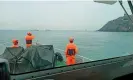  ?? Coast Guard/Reuters ?? Members of Taiwan’s coast guard work during a rescue operation after a boat capsized near Taiwan-controlled Kinmen islands on 14 March. Photograph: Taiwan