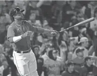  ?? BOB DECHIARA/USA TODAY SPORTS ?? Red Sox shortstop Xander Bogaerts hits a two-run home run against the Yankees on Tuesday in an AL wild-card game at Fenway Park in Boston. The Red Sox won 6-2.