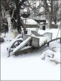  ?? JON HAMMOND / FOR TEHACHAPI NEWS ?? An old wheelbarro­w rests in the snow.