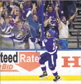  ?? Chris O'Meara Associated Press ?? ONDREJ PALAT rejoices in front of fans after his game-winning score. Tampa Bay erased a two-goal deficit and avoided a 3-0 series hole against the Rangers.