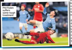  ??  ?? Phil Foden suffers some rough treatment