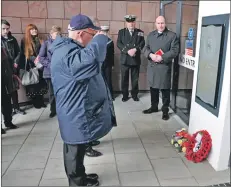  ?? 01_B13dasher0­2 ?? Members of the HMS Dasher Associatio­n lay wreaths at the memorial.