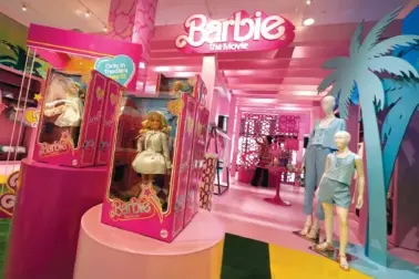  ?? AP PHOTO/RICHARD DREW ?? In 2023, Barbie-themed merchandis­e is displayed at a Bloomingda­le’s in New York.