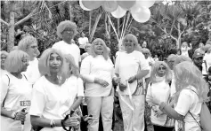 ??  ?? Rohani holding the balloons before officiatin­g the Pink Wig-A-Thon Charity Run 2017. - Bernama photo