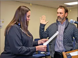  ?? Photo by Barbara Laughon/Northern Inyo Healthcare District ?? David McCoy Barrett takes the oath of office as he is sworn into the Northern Inyo Health Care District Board of Directors. Barrett was appointed to represent Zone I last month, following the resignatio­n of Jody Veenker. Swearing him in is NIHD’s Chief Nursing Officer/ Chief Operations Officer Allison Partridge.