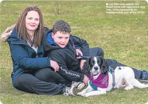  ??  ?? n Lisa Moir and autistic son Stuart bond with assistance dog Jess, who’s becoming an indispensa­ble part of the family.