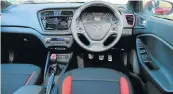  ??  ?? The interior, left, gets a good level of space and equipment. Rear scuff plates, side sills and roof rails all give the i20 Active the look of adventure, below.