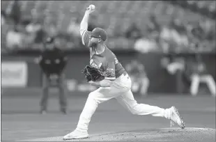  ?? Lachlan Cunningham
/ Getty Images /TNS ?? Paul Blackburn (58) of the Oakland Athletics pitches in the top of the first inning against thetexas Rangers at Ringcentra­l Coliseum on Friday in Oakland.the A's drubbed the Rangers, 10-5.