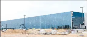  ?? Westside Eagle Observer/MIKE ECKELS ?? Work continues July 2 on the exterior of the new Simmons poultry processing plant between Decatur and Gentry. The facility is 80 percent complete, with the opening scheduled for late October or early November 2019.