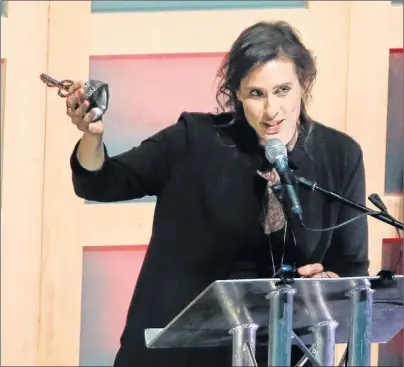  ?? TIM KROCHAK /THE CHRONICLE HERALD ?? Rose Cousins accepts the ECMA for song of the year during the 2018 ECMAs in Halifax.