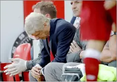  ??  ?? Arsenal manager Arsene Wenger reacts as assistant Steve Bould (right) looks on during a Premier League match. — Reuters photo