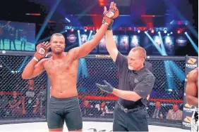  ?? LUCAS NOONAN/BELLATOR MMA ?? Christian Edwards acknowledg­es the crowd’s cheers after his victory over Justin Vargas on July 12. Edwards, who trains at Jackson-Wink, is scheduled to fight again Friday.