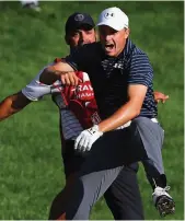  ?? — AFP ?? Jordan Spieth (right) celebrates with caddie Michael Greller after winning the playoff hole.