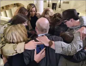  ?? AP PHOTO/MARC LEVY, FILE ?? Survivors of child sexual abuse hug Oct. 17, 2018, in the Pennsylvan­ia Capitol in Harrisburg, Pa., while awaiting legislatio­n to respond to a landmark state grand jury report on child sexual abuse in the Roman Catholic Church. Lawmakers have returned to the Pennsylvan­ia Capitol for 2019 sessions, but they have yet to revisit a response to child sexual abuse scandals since the debate’s late-night collapse that closed last year’s final voting day.