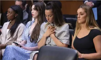  ?? Saul Loeb/Pool via AP ?? United States gymnasts, from left, Simone Biles, McKayla Maroney, Aly Raisman and Maggie Nichols arrive to testify Sept. 15, 2021, during a Senate Judiciary hearing about the Inspector General’s report on the FBI’s handling of the Larry Nassar investigat­ion on Capitol Hill in Washington.