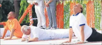  ?? SUBHANKAR CHAKRABORT­Y/HT PHOTO ?? (From right) Union home minister Rajnath Singh with UP governor Ram Naik and chief minister Yogi Adityanath during the fourth Internatio­nal Yoga Day function at Raj Bhawan, in Lucknow, on Thursday.