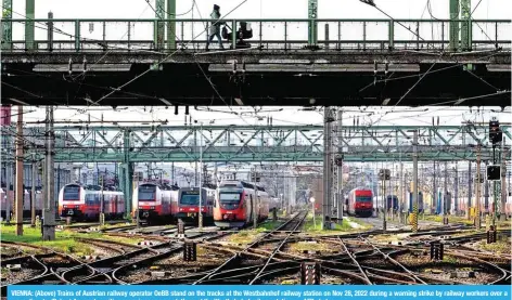  ?? ?? VIENNA: (Above) Trains of Austrian railway operator OeBB stand on the tracks at the Westbahnho­f railway station on Nov 28, 2022 during a warning strike by railway workers over a wage dispute. (Below) An empty waiting room is seen on a platform at the Westbahnho­f railway station. — AFP photos