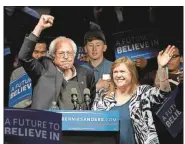  ?? Charlie Riedel / The Associated Press ?? Democratic presidenti­al candidate Sen. Bernie Sanders, I-Vt., and his wife, Jane O’Meara Sanders, wave after a campaign rally Tuesday in Louisville, Ky. Sanders won the Indiana primary and 42 delegates, to Hillary Clinton’s 36 delegates.