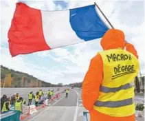  ?? SYLVAIN THOMAS / AFP ?? Integrante do “coletes amarelos” protesta contra Macron na França