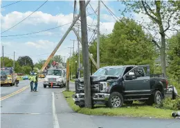  ?? RICH ROLEN/SPECIAL TO THE MORNING CALL ?? A driver of a pick-up truck struck two utility poles on William Penn Highway in Bethlehem Township on Tuesday after appearing to have suffered a “medical episode,” according to Police Chief Gregory Gottschall.