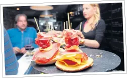  ??  ?? SNACK HAPPY: Tapas like this Jambon is a culinary emblem of Spain