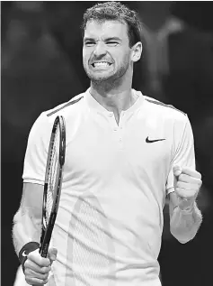  ??  ?? Grigor Dmitrov reacts after winning against David Goffin during their men’s singles roundrobin match on day four of the ATP World Tour Finals tennis tournament at the O2 Arena in London. — AFP photo