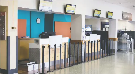  ?? DAX MELMER ?? The interior of Windsor Internatio­nal Airport was empty on Thursday as airlines temporaril­y shut down local operations in an effort to counter the coronaviru­s outbreak.
