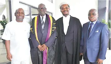  ?? ?? Immediate past Secretary to the Abia State Government, Chris Ezem ( left); Life Bencher, Mr R A Lawal- Rabana ; new wig, Mr David Chikemka Nwobike and his father, Dr Joseph Nwobike during David's call to Bar ceremony in Abuja.