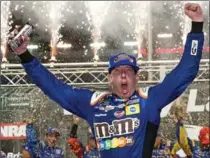  ?? BRIAN LAWDERMILK, GETTY IMAGES ?? ’Good guy’ Martin Truex Jr. is doused by his crew after winning at Watkins Glen, left, while ’Rowdy’ Kyle Busch whoops it up after his victory at Bristol.