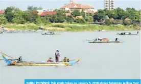  ??  ?? KANAL PROVINCE: This photo taken on January 5, 2018 shows fishermen pulling their nets in the Mekong river. — AFP