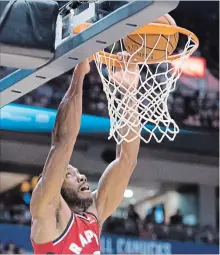  ?? JONATHAN HAYWARD THE CANADIAN PRESS ?? Kawhi Leonard scores two of his 12 points during pre-season NBA action against the Portland Trail Blazers in Vancouver on Saturday.