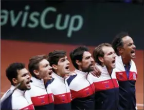  ?? THIBAULT CAMUS — THE ASSOCIATED PRESS ?? The French team, from the left, France’s Jo-Wilfried Tsonga, Pierre Hughes Herbert, Nicolas Mahut, Jeremy Chardy , Lucas Pouille and team captain Yannick Noah sing the national anthem before the Davis Cup final between France and Croatia Sunday in Lille, northern France.