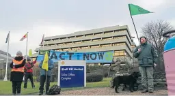  ??  ?? Activists outside Shell’s headquarte­rs in Aberdeen.