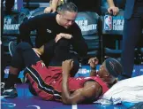  ?? CHRIS SZAGOLA/AP ?? Jimmy Butler suffered a knee injury in the Heat’s loss to the 76ers on Wednesday and will miss Friday’s do-or-die play-in game against the Bulls.