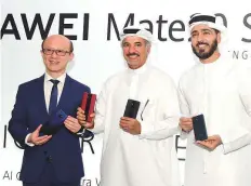  ?? Arshad Ali/Gulf News ?? Gene Jiao, president of Huawei Consumer Business group Middle East and Africa; Saeed Hareb, Secretary General of the Dubai Sports Council, and Issam Kazim, CEO of Dubai Tourism, at the launch of Huawei Mate20 Series at Burj Park.