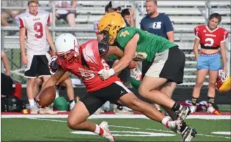  ?? PHOTO/RUSTY NIXON ?? Exander Ramirez is brought down after a gain by a Tippecanoe Valley defender in Plymouth scrimmage action.