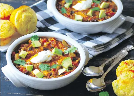  ??  ?? This nicely spiced meat-free chili contains red lentils, two types of beans and vegetables. Serve it with cornbread muffins.