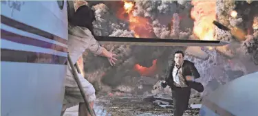  ?? COLUMBIA PICTURES ?? John Cusack tries to flee the end of the world in the 2009 movie “2012.” The apocalypse foretold in the movie didn’t exactly come to pass.