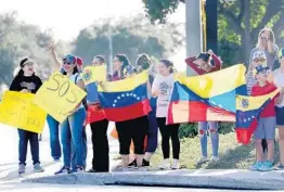  ?? MIKE STOCKER/SOUTH FLORIDA SUN SENTINEL 2019 ?? Protesters gather on the corner of Sample Road and University Drive in Coral Springs to bring attention to turmoil in Venezuela.