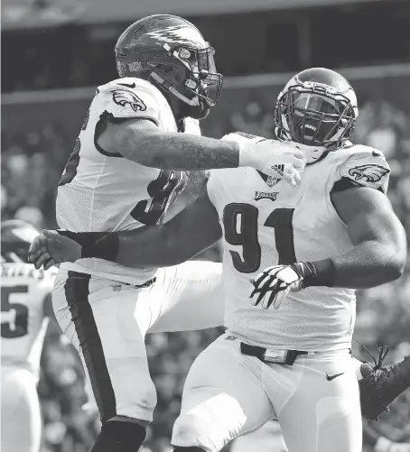  ?? ALEX BRANDON/THE ASSOCIATED PRESS ?? Philadelph­ia Eagles defensive tackle Fletcher Cox, right, and his fellow defensive linemen will need to play a leading role if the Eagles hope to contain the high-octane New England Patriots offence in Sunday’s Super Bowl LII in Minneapoli­s, Minn.