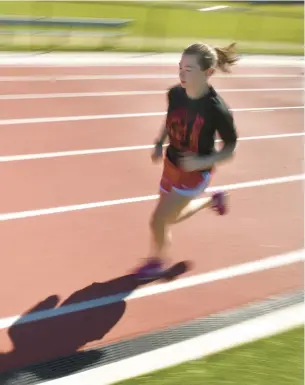  ?? CLOE POISSON/SPECIAL TO THE COURANT ?? Rachel St. Germain, 17, won the national indoor 5,000 meter championsh­ip in March and is a State Open and New England cross country champion.