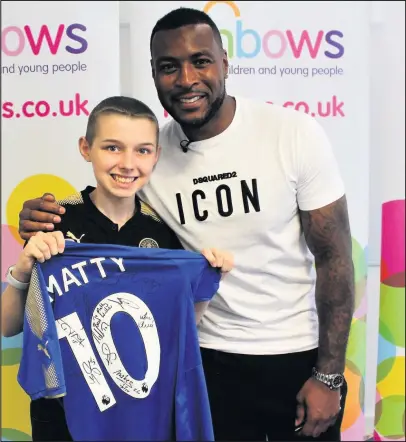  ??  ?? Matty Hatton (13) from Mountsorre­l pictured with Leicester City captain Wes Morgan at Rainbows Hospice.