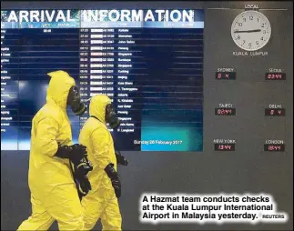  ??  ?? A Hazmat team conducts checks at the Kuala Lumpur Internatio­nal Airport in Malaysia yesterday.